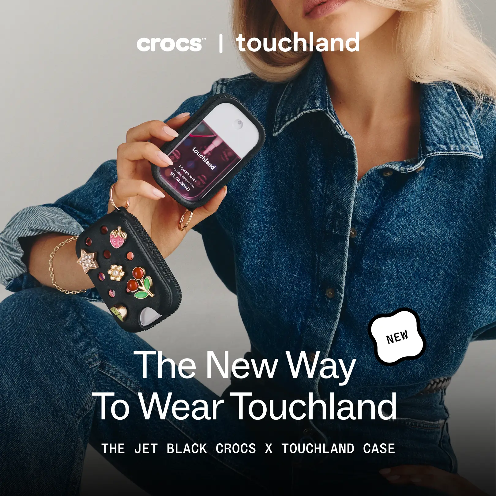 Touchland — Crocs Jet Black sanitizer case styled with denim