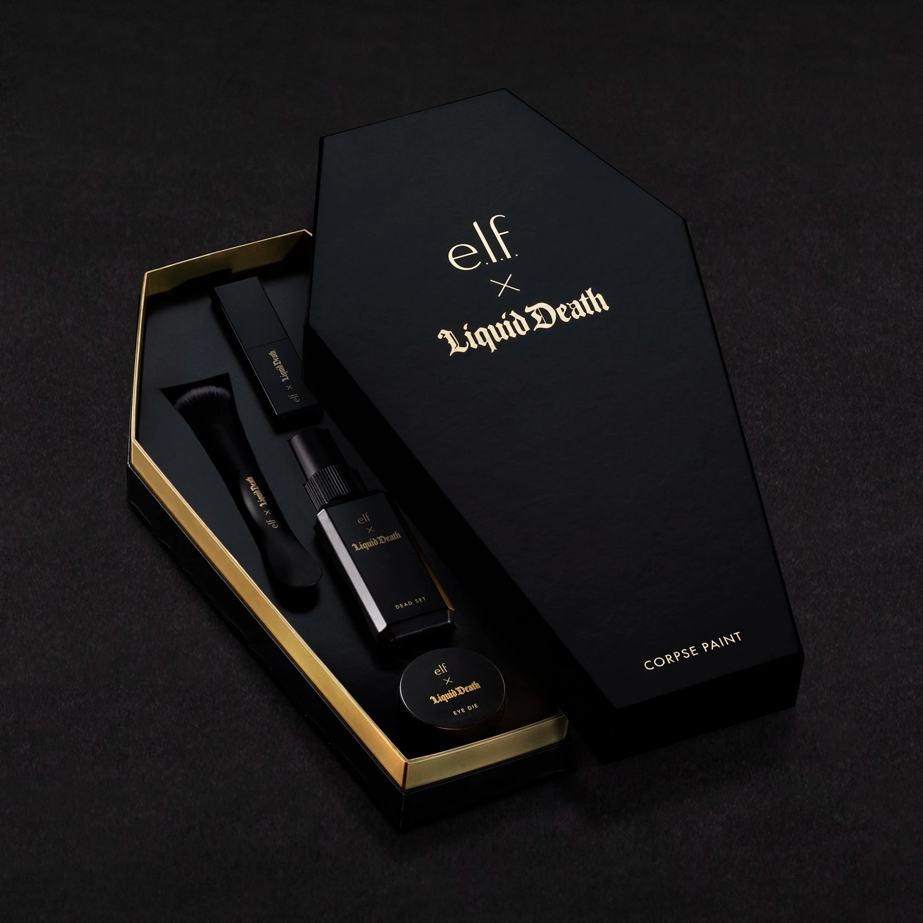 The black and gold e.l.f. × Liquid Death Corpse Paint coffin-shaped makeup vault